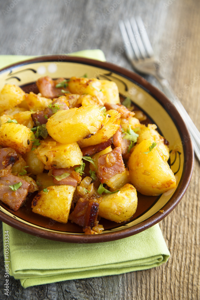 Fried potatoes with pork and onion