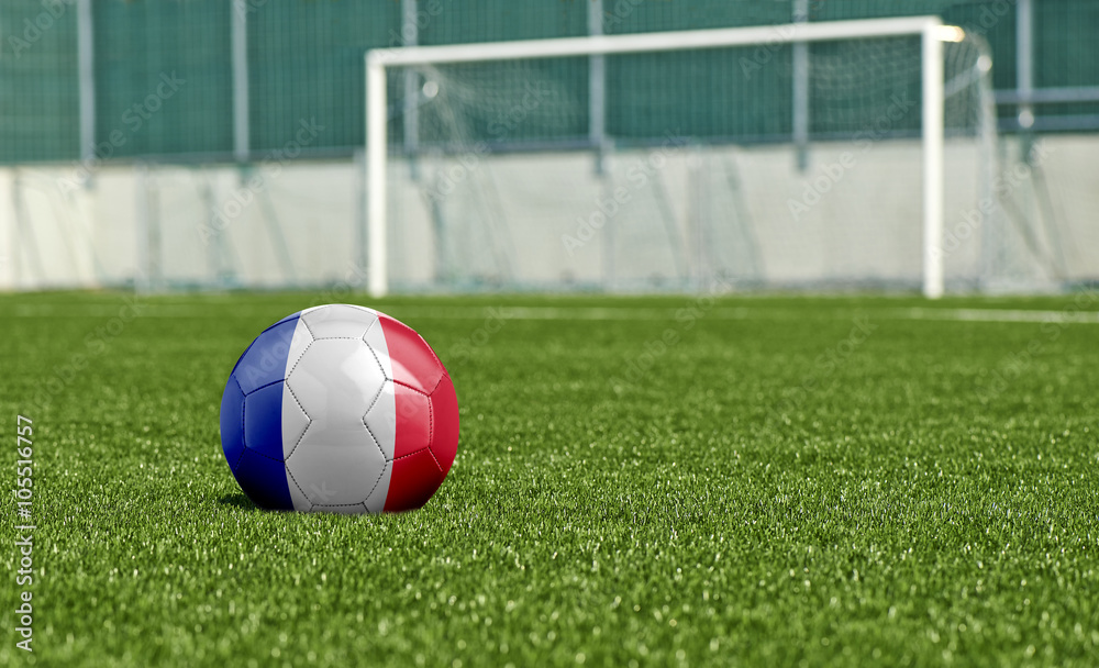 Naklejka Piłka nożna na zielonym boisku - flaga Francji