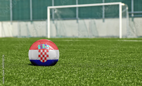 Soccer ball on the green field- flag Croatia