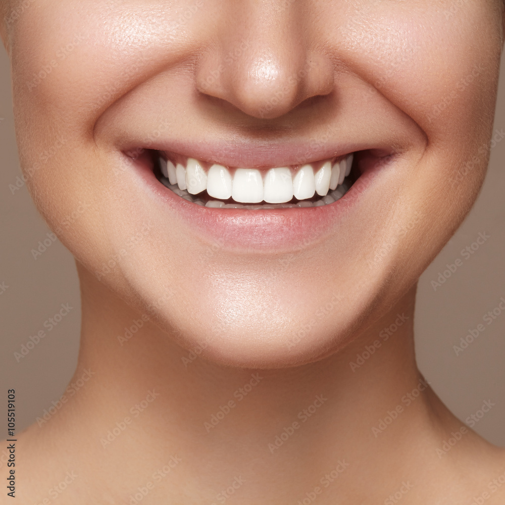 Obraz premium Beautiful smile with whitening teeth. Dental photo. Macro closeup of perfect female mouth, lipscare rutine