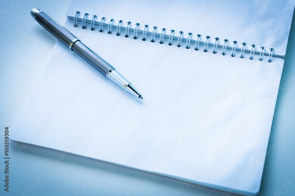 Open notebook with metallic ball pen Open notebook with metallic ball pen