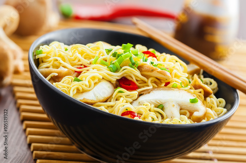 Instant noodles with shiitake mushrooms and vegetables, traditional Asian food, close-up