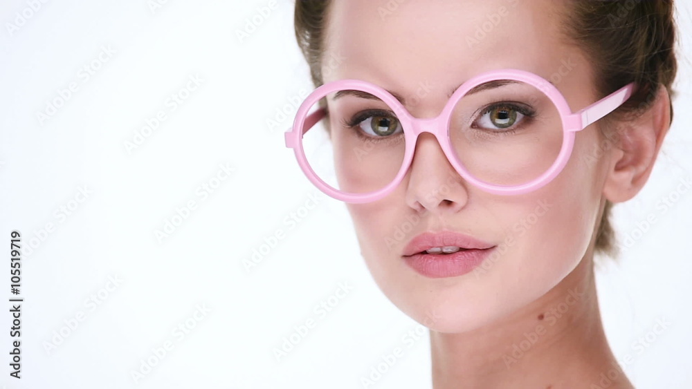 Upset serious woman posing at camera on white background Upset serious woman posing at camera on white background