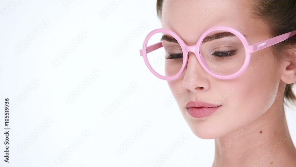 Upset serious woman posing at camera on white background Upset serious woman posing at camera on white background