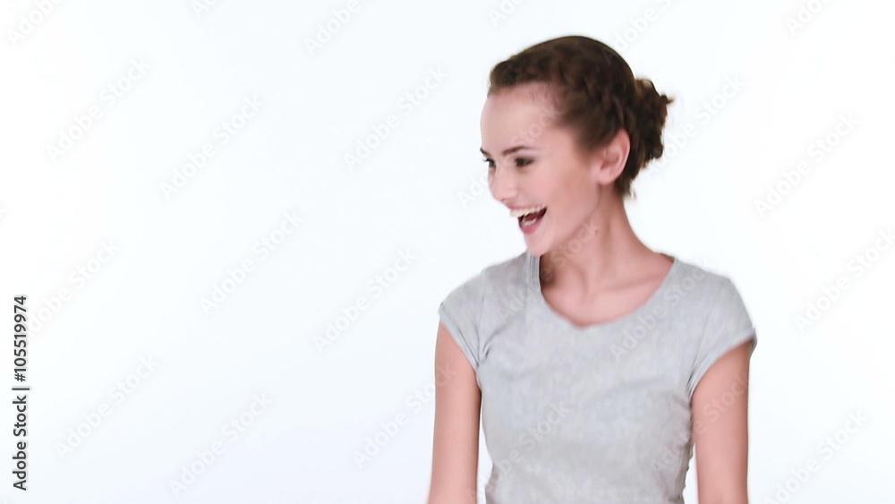 Young fun excited woman dancing in studio over white background Young fun excited woman dancing in studio over white background