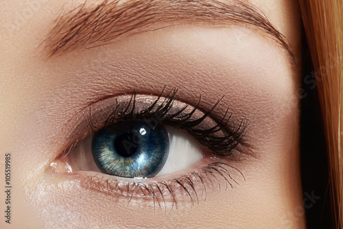 Fototapeta Naklejka Na Ścianę i Meble -  Clean vision, lens. Beautiful macro shot of female eye with classic smoky makeup. Cosmetics and make-up