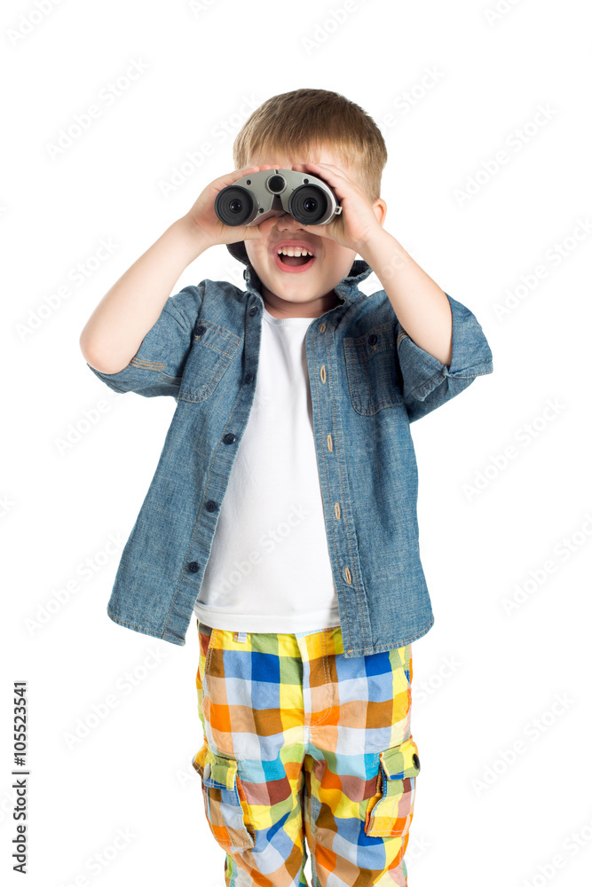 Little boy child on white background with binoculars