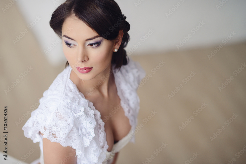 Female portrait of cute lady in white bra indoors. Close-up beautiful sexy model girl in elegant pose. Beauty brunette woman with hairstyle Female portrait of cute lady in white bra indoors. Close-up beautiful sexy model girl in elegant pose. Beauty brunette woman with hairstyle