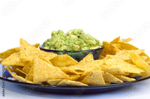 Guacamole and Chips Plate – Fresh guacamole surrounded by corn tortilla chips.