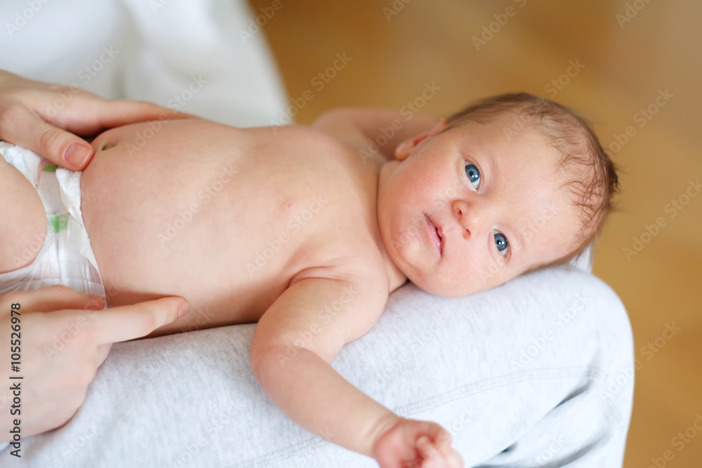 One month old newborn baby with mother One month old newborn baby with mother