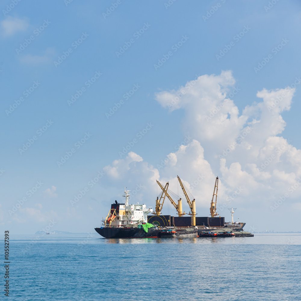 Cargo ship sailing in ocean Cargo ship sailing in ocean