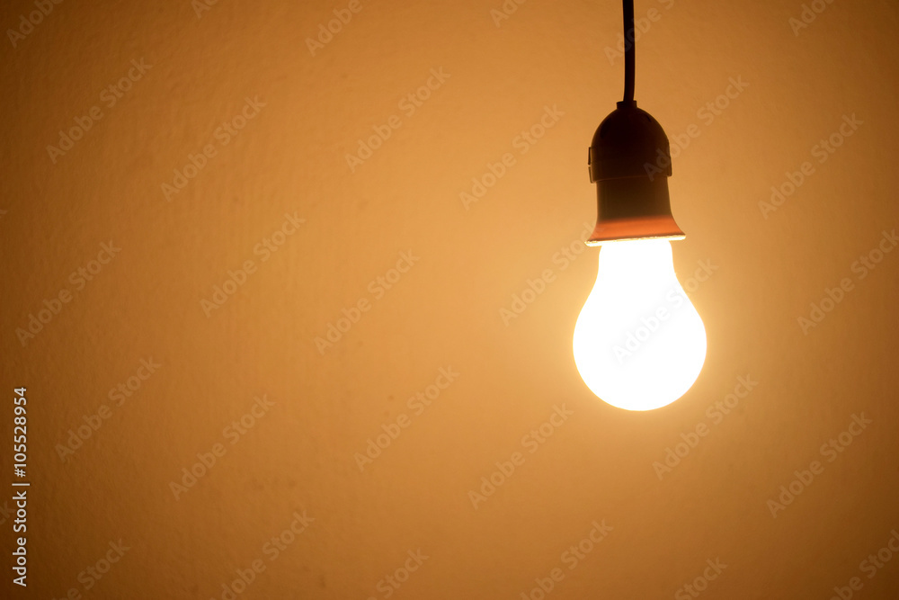 Incandescent light bulb orange light on wall Incandescent light bulb orange light on wall