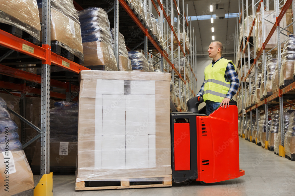 man on forklift loading cargo at warehouse man on forklift loading cargo at warehouse