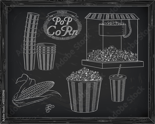 Popcorn machine, ear of corn, stack of small & big popcorn boxes