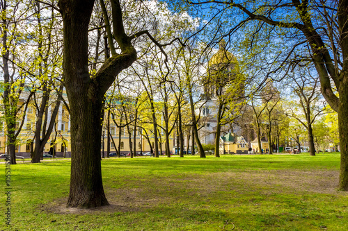 Alexandrovsky Garden in Saint-Petersburg and St. Isaac's Cathedral behind the trees
