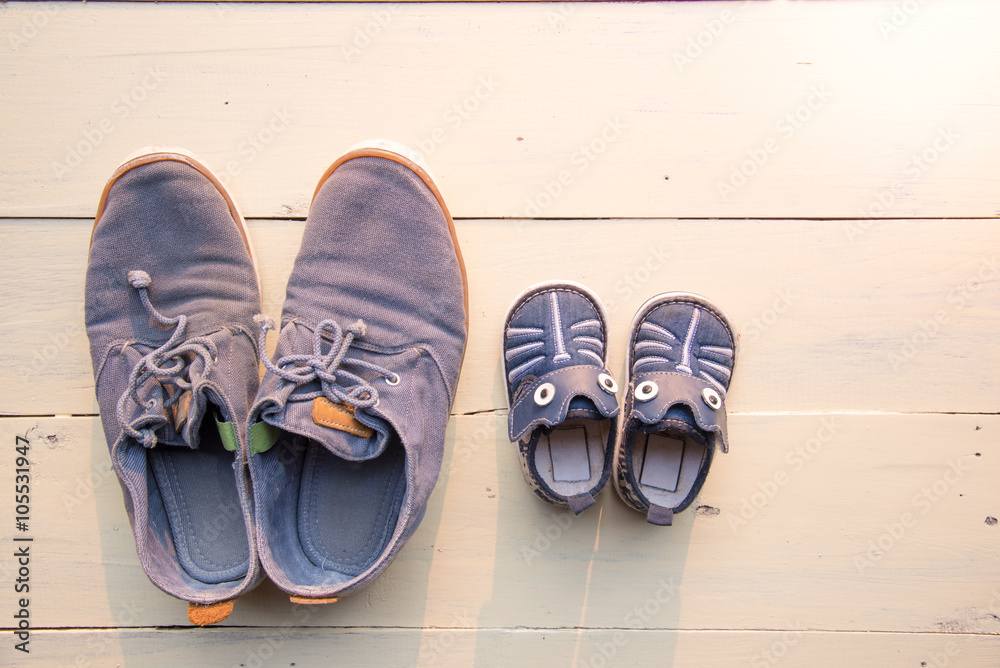 top view of father and baby shoe put together top view of father and baby shoe put together