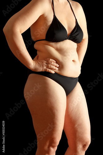 woman body fat black background