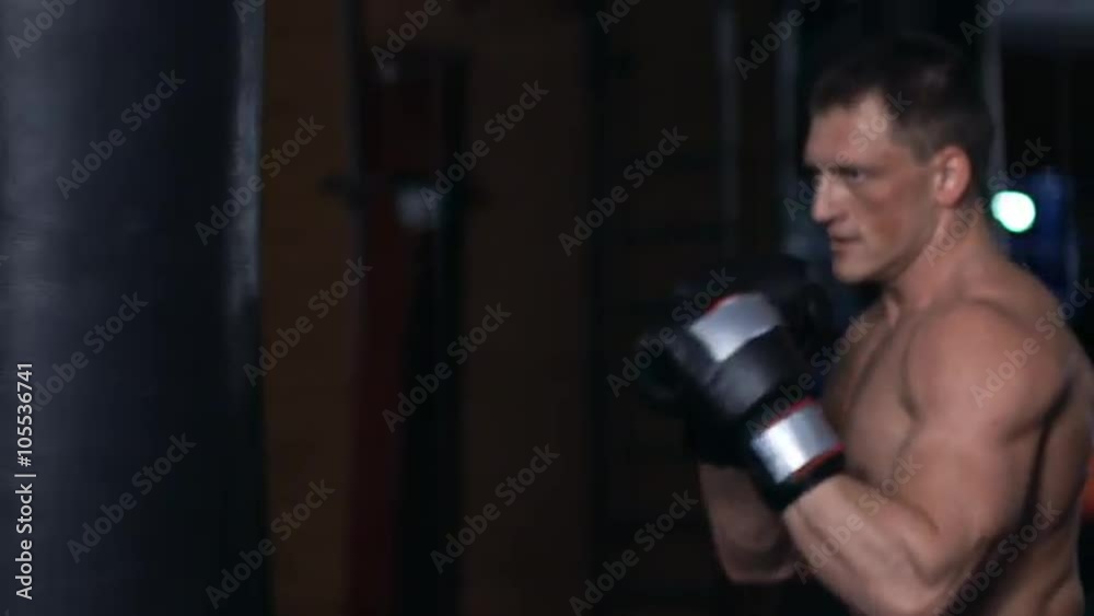 Handsome fit man boxing. Slow motion Handsome fit man boxing. Slow motion