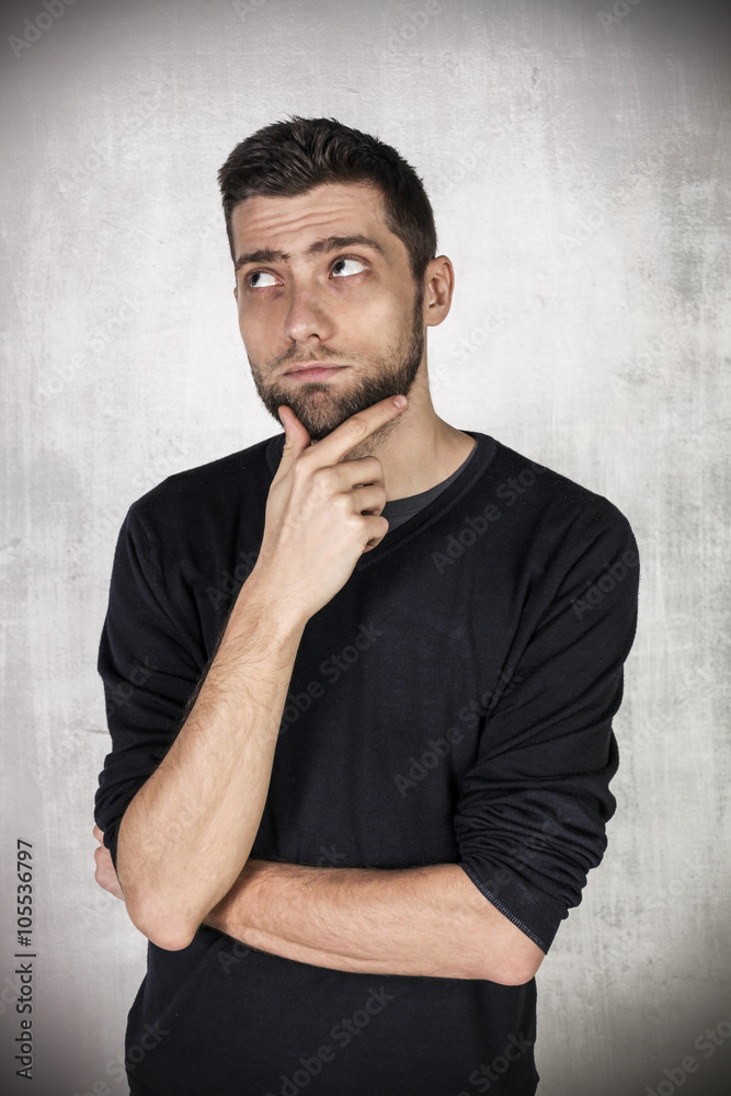 Portrait of doubtful young man