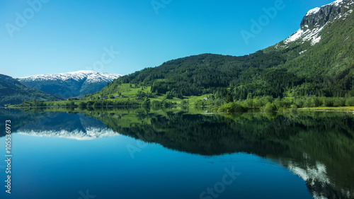 Magic reflection.  Mountains reflect in the lake. Norway