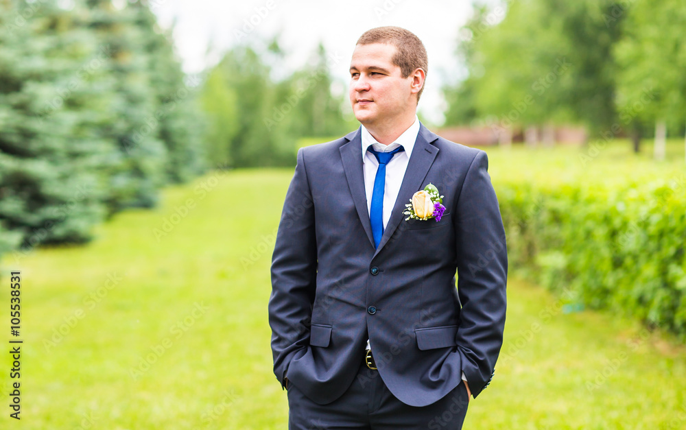 Groom in suit on the nature. Male portrait outdoors. Handsome guy outdoors Groom in suit on the nature. Male portrait outdoors. Handsome guy outdoors