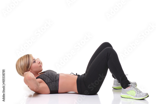  woman smiling and doing exercises for the abs