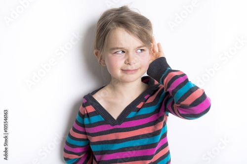 cute cheerful little girl portrait, isolated on gray background