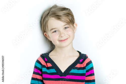cute cheerful  little girl portrait, isolated on gray background © Louis-Photo