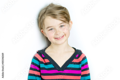 cute cheerful  little girl portrait, isolated on gray background