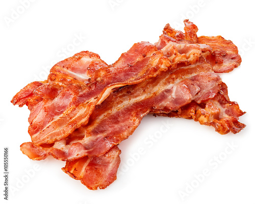 Cooked bacon rashers close-up isolated on a white background.