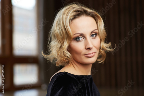Beautiful Middle Aged Woman in her thirties  looking at camera