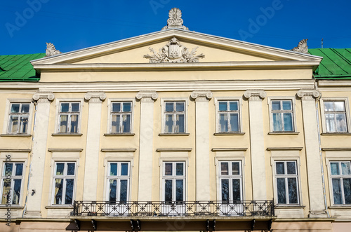 Lviv regional administration building with columns, windows and balcony on a sunny day