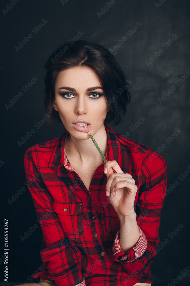 Fototapeta premium lollipop in the mouth (close-up) of woman