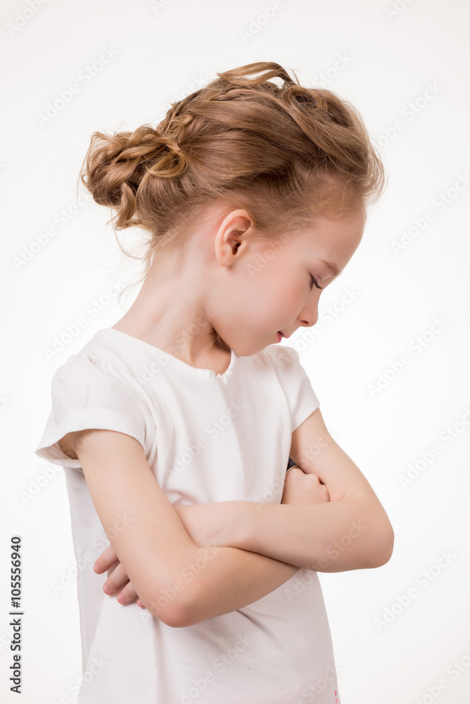 Cute teen girl angry frowns, studio portrait isolated on white background