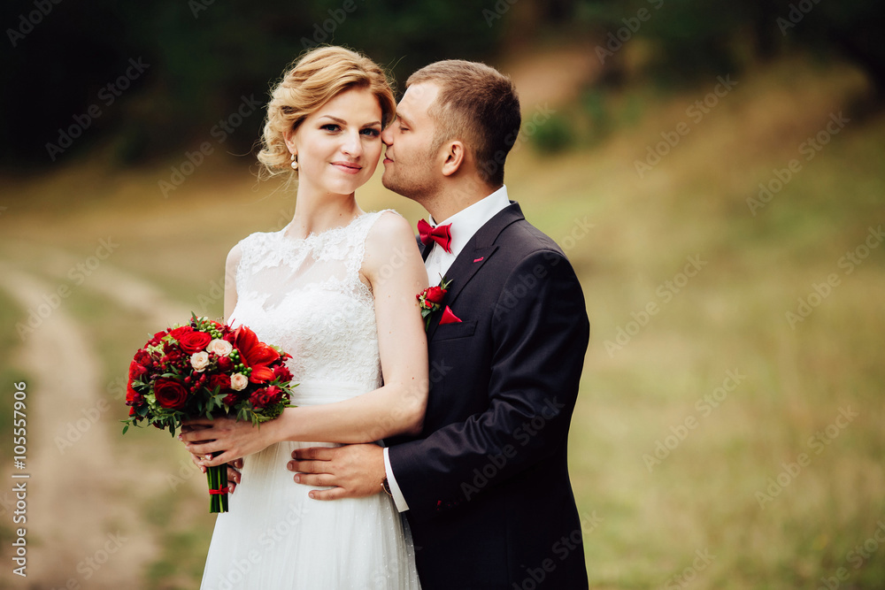 Happy wedding couple lovely hugging and smiling each other Happy wedding couple lovely hugging and smiling each other