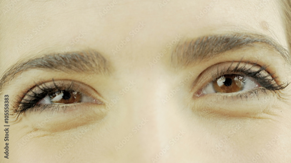 Closeup of beautiful brown eyes smiling 4K