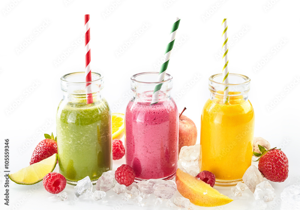 Long row of tropical fruit drinks in tall glasses Long row of tropical fruit drinks in tall glasses