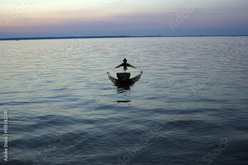 submerged boat in the evenind photo
