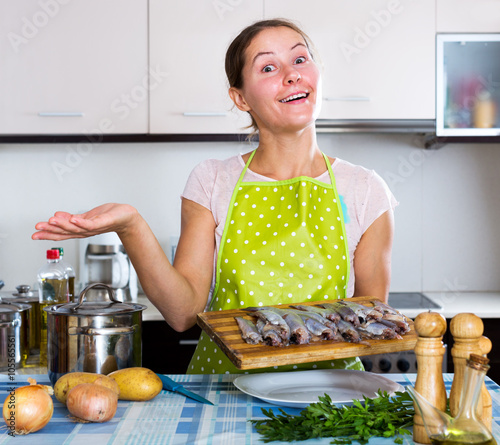 Happy housewife trying new recipe photo