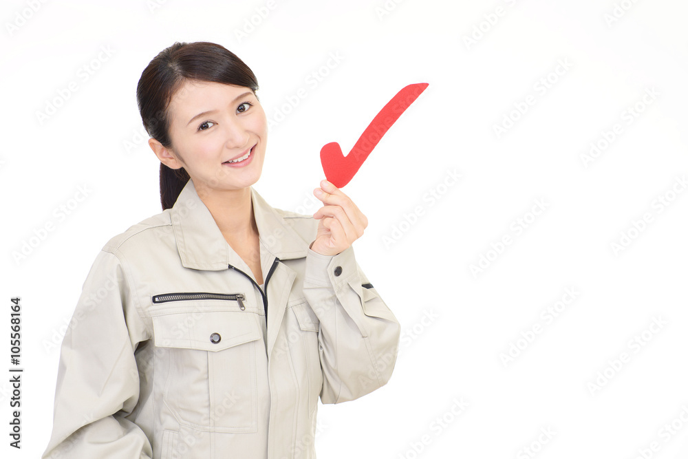チェックマークを持つ女性作業員 Stock Photo Adobe Stock