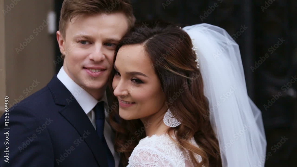 Beautiful bride holding each others and posing on camera. Beautiful bride holding each others and posing on camera.
