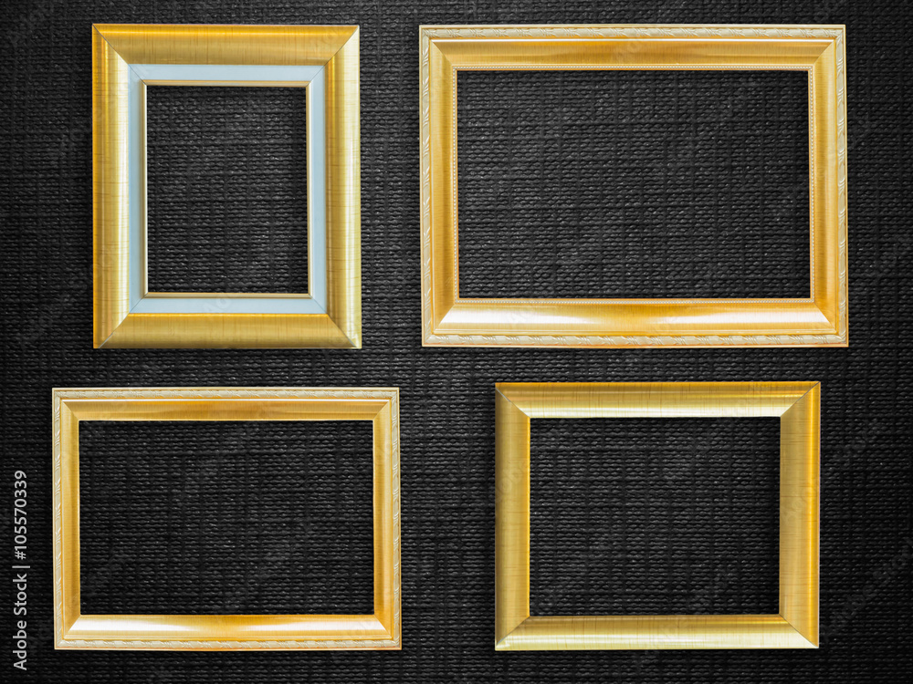 Fototapeta premium Golden picture frame over black background