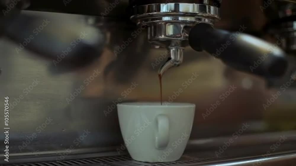 Barista making coffee in coffeeshop. Close up Barista making coffee in coffeeshop. Close up