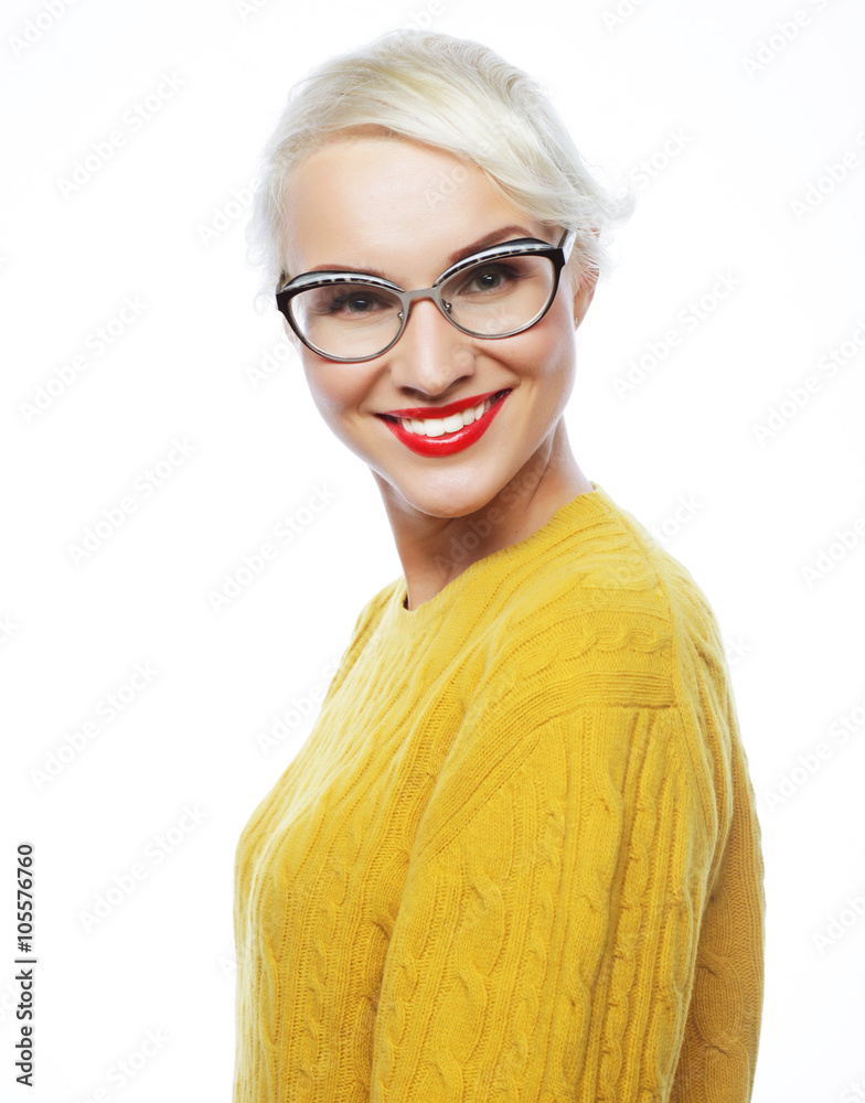 Young blond woman wearing yellow sweater