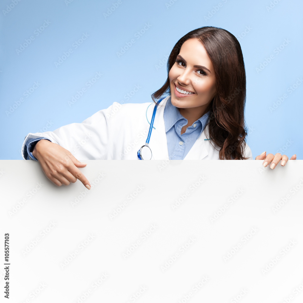 doctor showing blank signboard with copyspace doctor showing blank signboard with copyspace