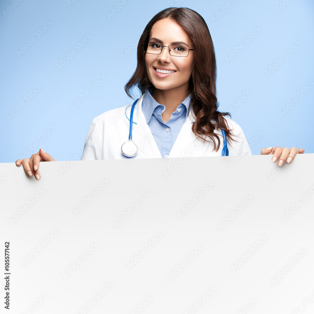 doctor showing blank signboard with copyspace doctor showing blank signboard with copyspace