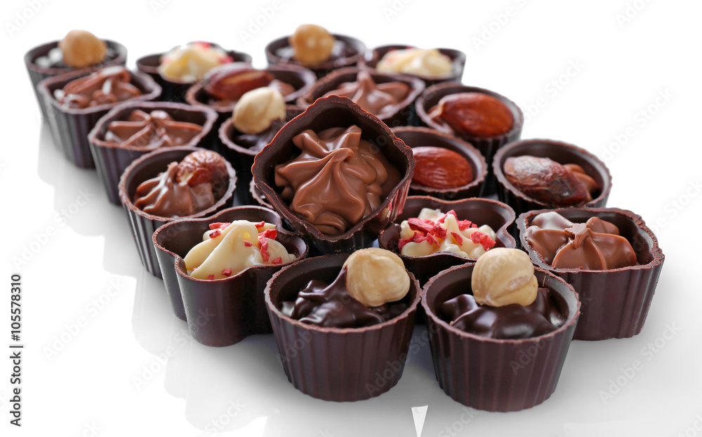 Delicious chocolate candies on white background Delicious chocolate candies on white background