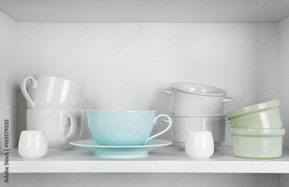 Dishes in cupboard in the kitchen Dishes in cupboard in the kitchen