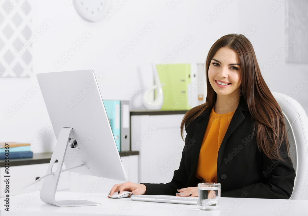 A beautiful successful woman working at the modern office