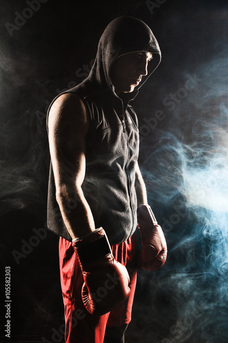 Fototapeta Naklejka Na Ścianę i Meble -  The young  man kickboxing 